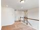 Bright loft overlooking the main level with neutral carpeting at 2074 Van Buren Rd, Sherrills Ford, NC 28673