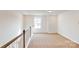 Spacious loft area with a large window and carpet flooring at 2074 Van Buren Rd, Sherrills Ford, NC 28673