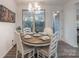 Bright dining area with a round wooden table and white chairs at 13050 Regent Grove Ln, Huntersville, NC 28078