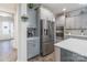 Kitchen boasts stainless steel appliances and ample gray cabinetry at 13050 Regent Grove Ln, Huntersville, NC 28078