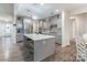 Spacious kitchen featuring gray cabinets, an island, and hardwood floors at 13050 Regent Grove Ln, Huntersville, NC 28078