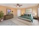 Main bedroom with carpeted floor, ceiling fan, and large bed at 11434 Lamoille Ln, Charlotte, NC 28278