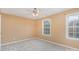 Bright bedroom with neutral walls, carpet, and two windows at 11434 Lamoille Ln, Charlotte, NC 28278