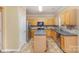 Kitchen boasts an island, stainless steel appliances, and wood cabinets at 11434 Lamoille Ln, Charlotte, NC 28278