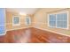 Spacious living room with hardwood floors and neutral color walls at 11434 Lamoille Ln, Charlotte, NC 28278