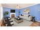 Living room with fireplace, hardwood floors, and staged furniture at 11434 Lamoille Ln, Charlotte, NC 28278