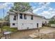 House's rear view, showcasing a patio and partial view of the backyard at 317 Kerr Nw St, Concord, NC 28025