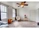 Serene bedroom with an armchair, natural light, and window coverings at 317 Kerr Nw St, Concord, NC 28025