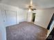 Spacious bedroom with ample closet space and neutral carpeting at 317 Kerr Nw St, Concord, NC 28025