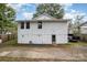 White house exterior with a large backyard and driveway at 317 Kerr Nw St, Concord, NC 28025