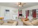 Living room with comfy seating, tv, and access to front door at 317 Kerr Nw St, Concord, NC 28025