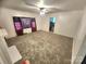 Spacious living room featuring carpeted floors and a window with curtains at 317 Kerr Nw St, Concord, NC 28025