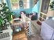 Cozy sunroom with light blue walls and wicker furniture at 317 Kerr Nw St, Concord, NC 28025