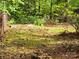 Tranquil backyard with lush greenery, a stacked stone feature, and a serene natural ambiance at 331 Sunderland Rd, Belmont, NC 28012