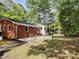 Cozy brick home with a fenced backyard and mature trees, offering privacy and charm at 331 Sunderland Rd, Belmont, NC 28012