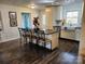 Open floor plan kitchen with island, farm sink, and dark wood flooring at 331 Sunderland Rd, Belmont, NC 28012