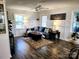 Bright living room featuring hardwood floors, wainscoting, and comfortable seating at 331 Sunderland Rd, Belmont, NC 28012