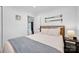 Bedroom featuring shiplap walls, a queen bed, and wood accents at 470 Lakeview Shores Loop, Mooresville, NC 28117