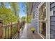 Exterior wooden deck area with black railings leading to glass sliding door at 470 Lakeview Shores Loop, Mooresville, NC 28117