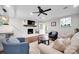 Bright living room featuring a fireplace, hardwood floors, and modern furnishings at 470 Lakeview Shores Loop, Mooresville, NC 28117