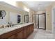 Elegant bathroom with double vanity, granite counters, and large shower at 494 Bowline Dr, Denver, NC 28037