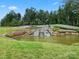 Community entrance with a pond and stone waterfall feature at 494 Bowline Dr, Denver, NC 28037