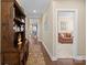 Hallway with hardwood floors, a built-in hutch, and access to living room at 494 Bowline Dr, Denver, NC 28037