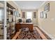 Bright home office with built-in shelving and hardwood floors at 494 Bowline Dr, Denver, NC 28037