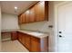 Good-sized laundry room with built-in cabinetry and sink at 494 Bowline Dr, Denver, NC 28037