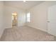Carpeted bedroom with natural light, a walk-in closet and an attached bathroom at 3228 Gavin Ln, Harrisburg, NC 28075