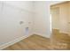 Bright laundry room featuring neutral walls and vinyl flooring at 3228 Gavin Ln, Harrisburg, NC 28075