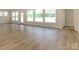 Spacious open floor plan living room area with multiple windows for ample natural light at 3228 Gavin Ln, Harrisburg, NC 28075