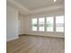 Spacious living room with large windows and hardwood floors throughout at 3228 Gavin Ln, Harrisburg, NC 28075
