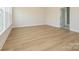 Large open room with hardwood floors and bright natural light at 3228 Gavin Ln, Harrisburg, NC 28075