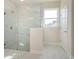 Modern bathroom featuring a frameless glass shower and marble-look tiling at 3228 Gavin Ln, Harrisburg, NC 28075