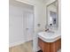 Stylish bathroom features a wood vanity, modern sink, and framed mirror at 435 S Tryon St # 301, Charlotte, NC 28202