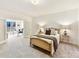 Elegant bedroom with decorative bed frame, side tables, and natural light at 435 S Tryon St # 301, Charlotte, NC 28202