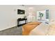 Bedroom featuring modern decor, natural light, dark console table, and a unique animal print carpet at 435 S Tryon St # 301, Charlotte, NC 28202