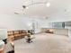 Spacious bonus room with carpet, leather sofa, and stylish decor at 435 S Tryon St # 301, Charlotte, NC 28202