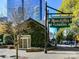 Charming building covered in lush greenery with a vintage-style sign for Ratcliffe's Flowers at 435 S Tryon St # 301, Charlotte, NC 28202