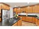 Gourmet kitchen featuring stainless steel appliances and rich wood cabinetry at 435 S Tryon St # 301, Charlotte, NC 28202