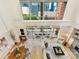 Bright living room featuring expansive windows with city views and modern decor at 435 S Tryon St # 301, Charlotte, NC 28202