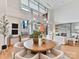 Open-concept living area featuring fireplace, views, and a round table perfect for gatherings at 435 S Tryon St # 301, Charlotte, NC 28202