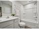 Clean bathroom featuring a shower-tub combo with modern fixtures and ample space at 5008 Winding Jordan Ln, Charlotte, NC 28269