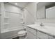 Bright bathroom featuring a shower-tub combo and a modern vanity with a white countertop at 5008 Winding Jordan Ln, Charlotte, NC 28269