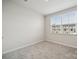 Bright bedroom with a neutral color scheme, a window view, and plush carpeting at 5008 Winding Jordan Ln, Charlotte, NC 28269