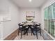 Cozy dining room with a table set for four, adjacent to sliding glass doors for a bright and airy atmosphere at 5008 Winding Jordan Ln, Charlotte, NC 28269