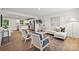 Open-concept living area with modern furniture and a view into the kitchen at 5008 Winding Jordan Ln, Charlotte, NC 28269