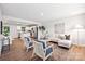 Bright and airy living room boasts hardwood floors and is open to the kitchen with a view of the stainless steel appliances at 5008 Winding Jordan Ln, Charlotte, NC 28269