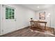 Bright home office with a desk, chair, and a door leading to the outdoors, offering a refreshing workspace at 5008 Winding Jordan Ln, Charlotte, NC 28269